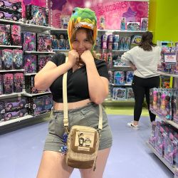 Katy wearing dinosaur head