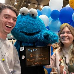 Katy and her friend Michael with a Cookie Moster mascot costume